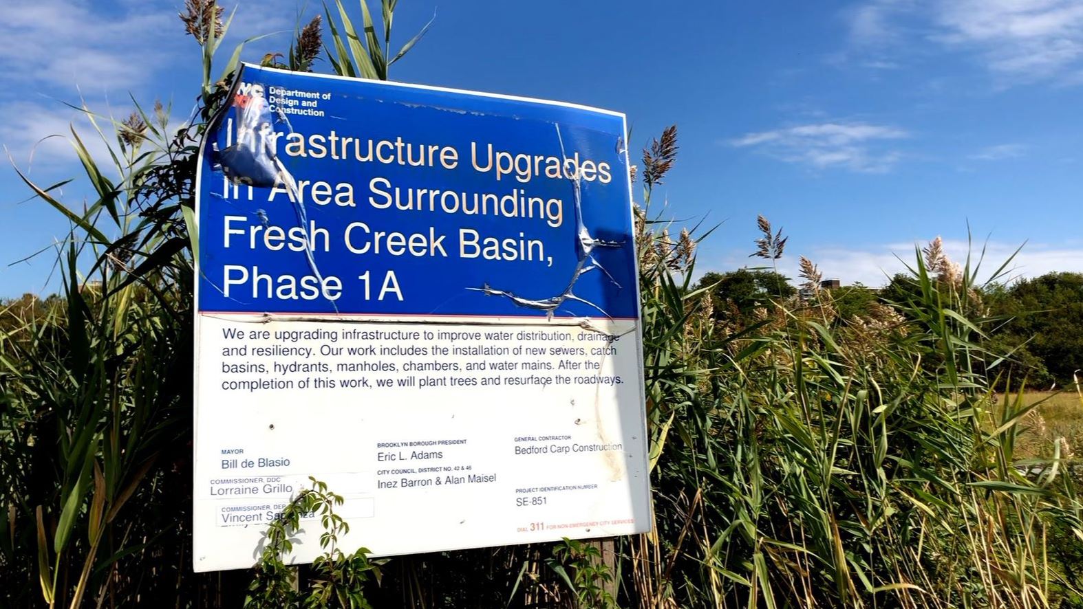 City signage provides information about infrastructure upgrades in Fresh Creek Basin. 
