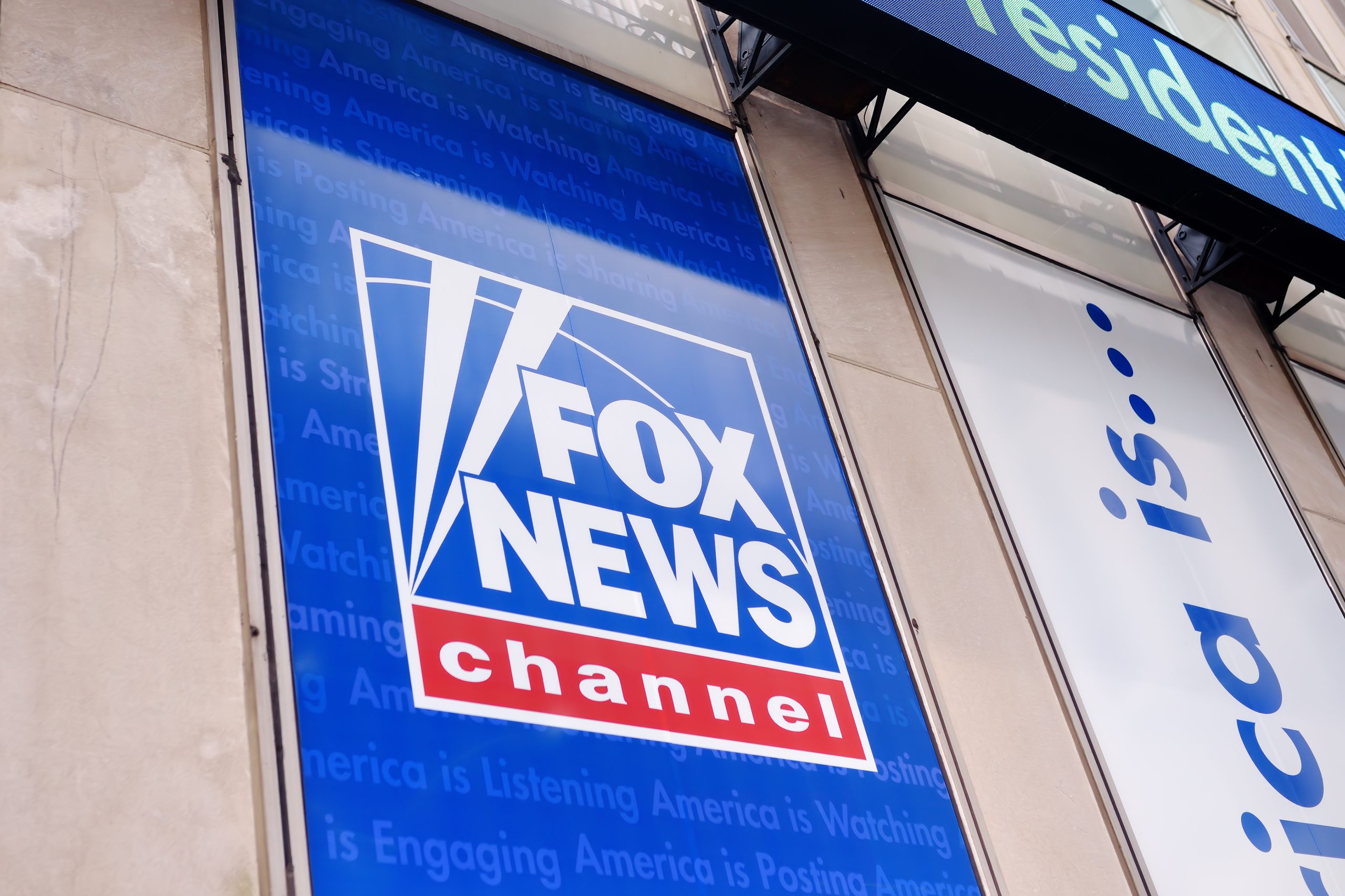 Image of Fox News Channel sign outside of building.